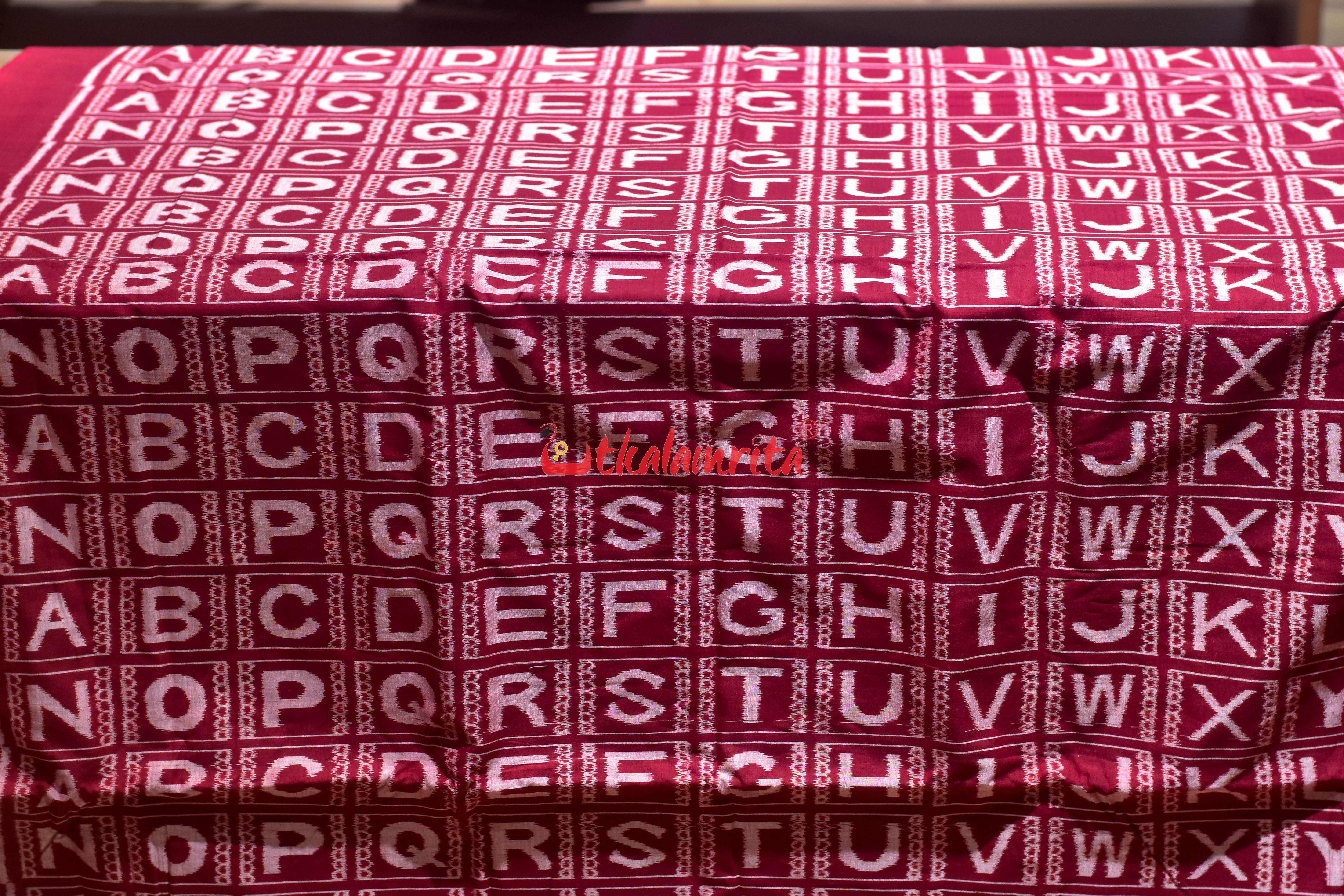 Maroon English Kothi Alphabets Cotton (Fabric)
