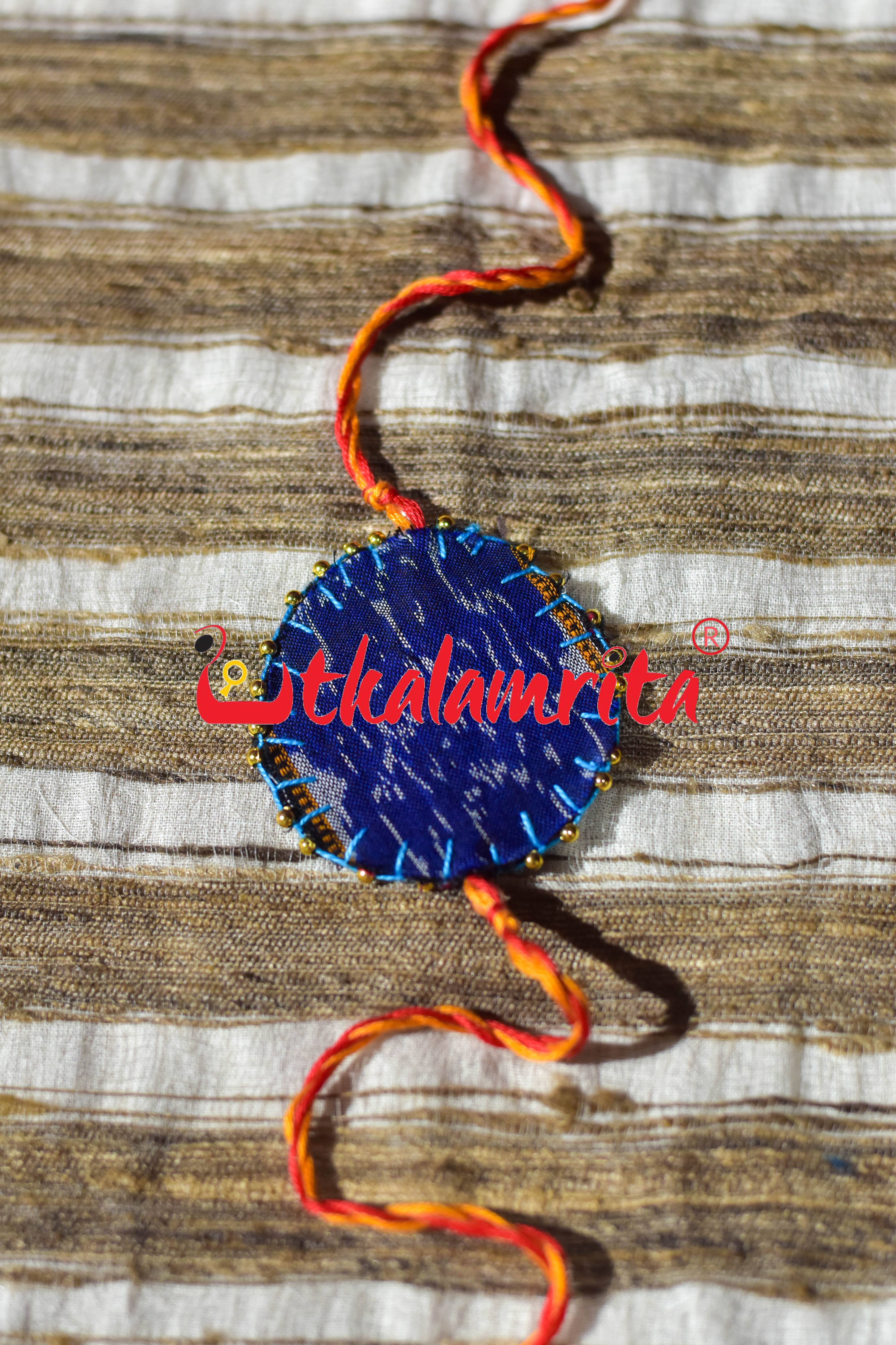 Round S Bandha Red (Ikat Rakhi)