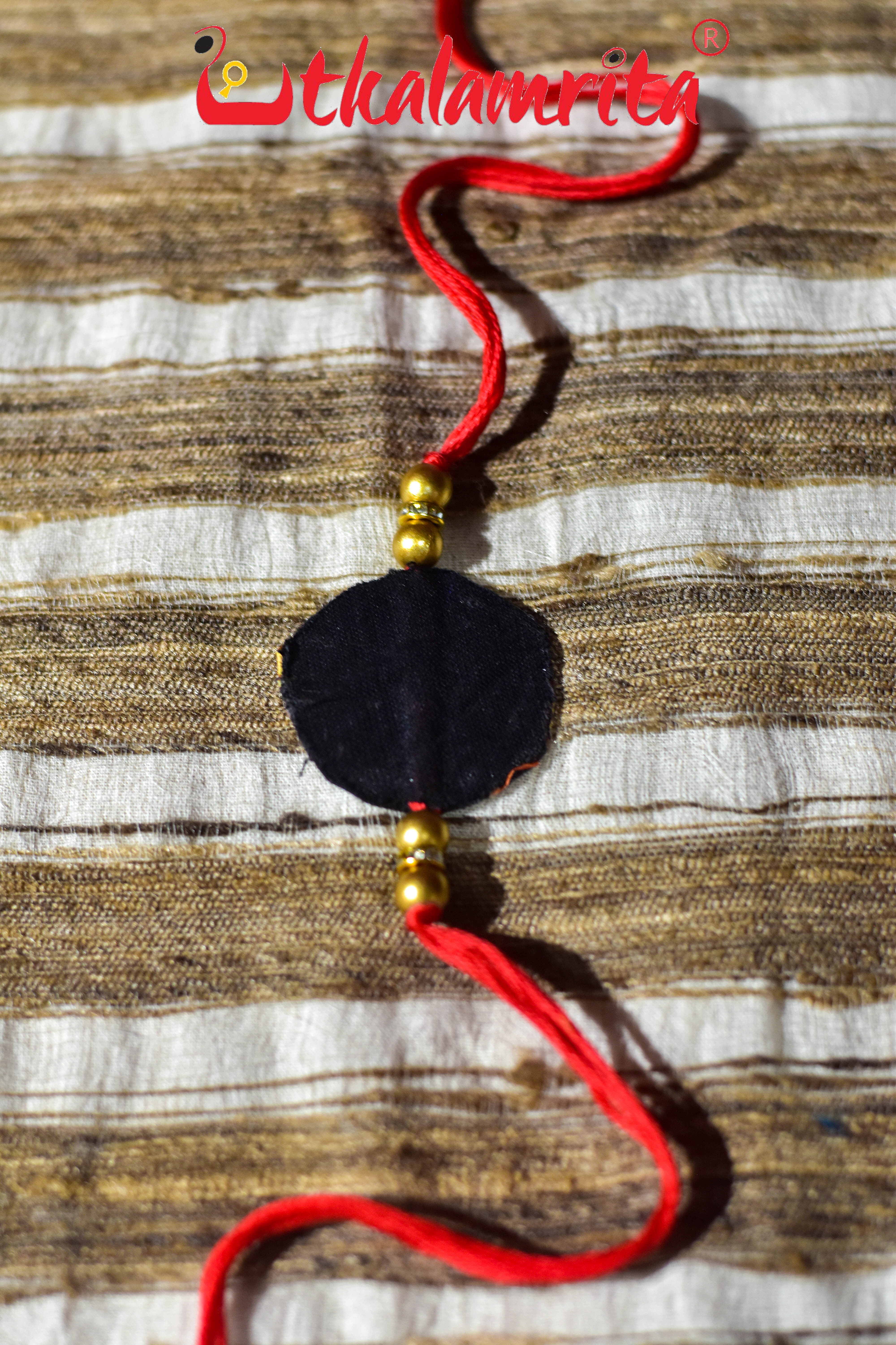 Black Round Flower Pattachitra (Ikat Rakhi)