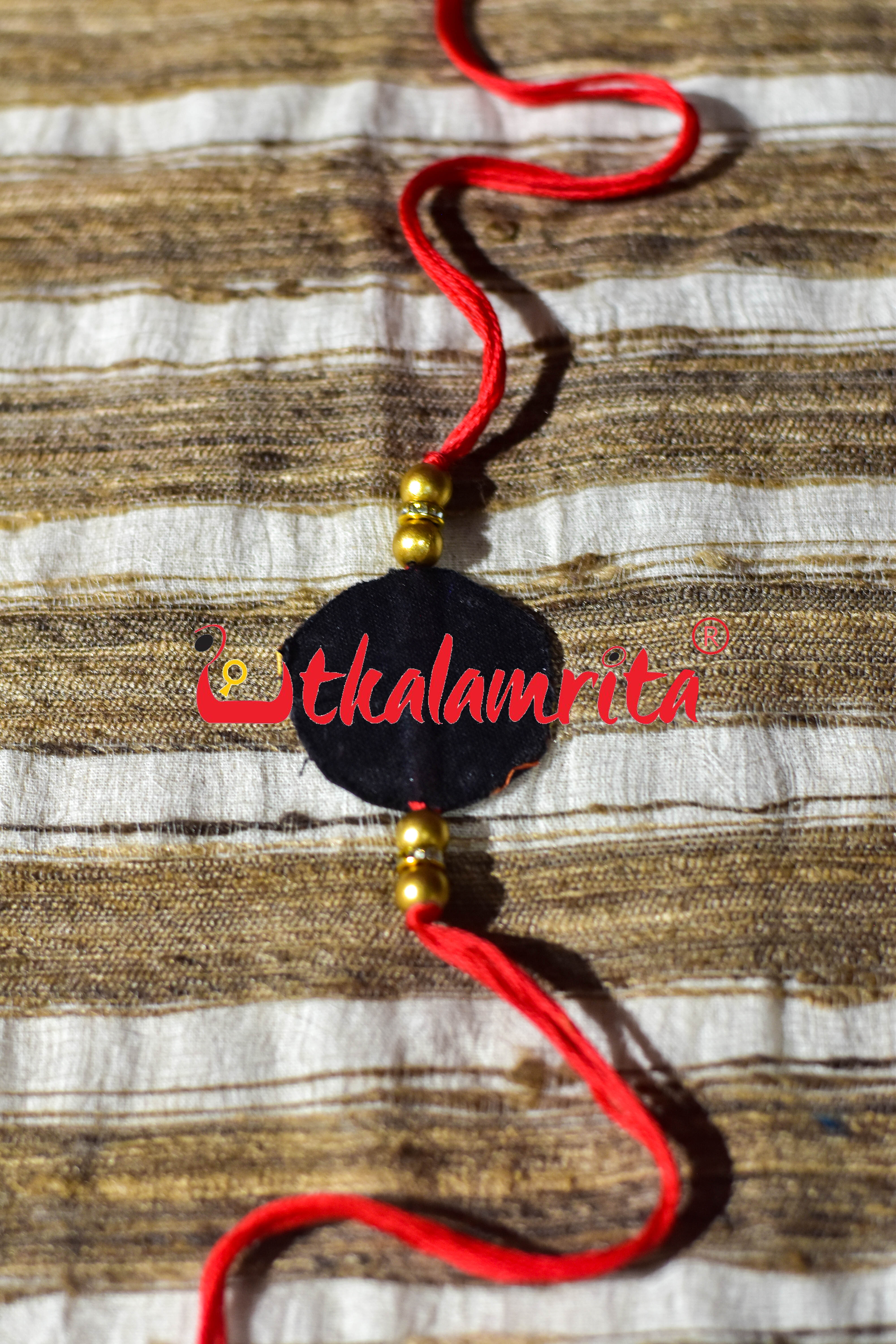 Black Round Flower Pattachitra (Ikat Rakhi)