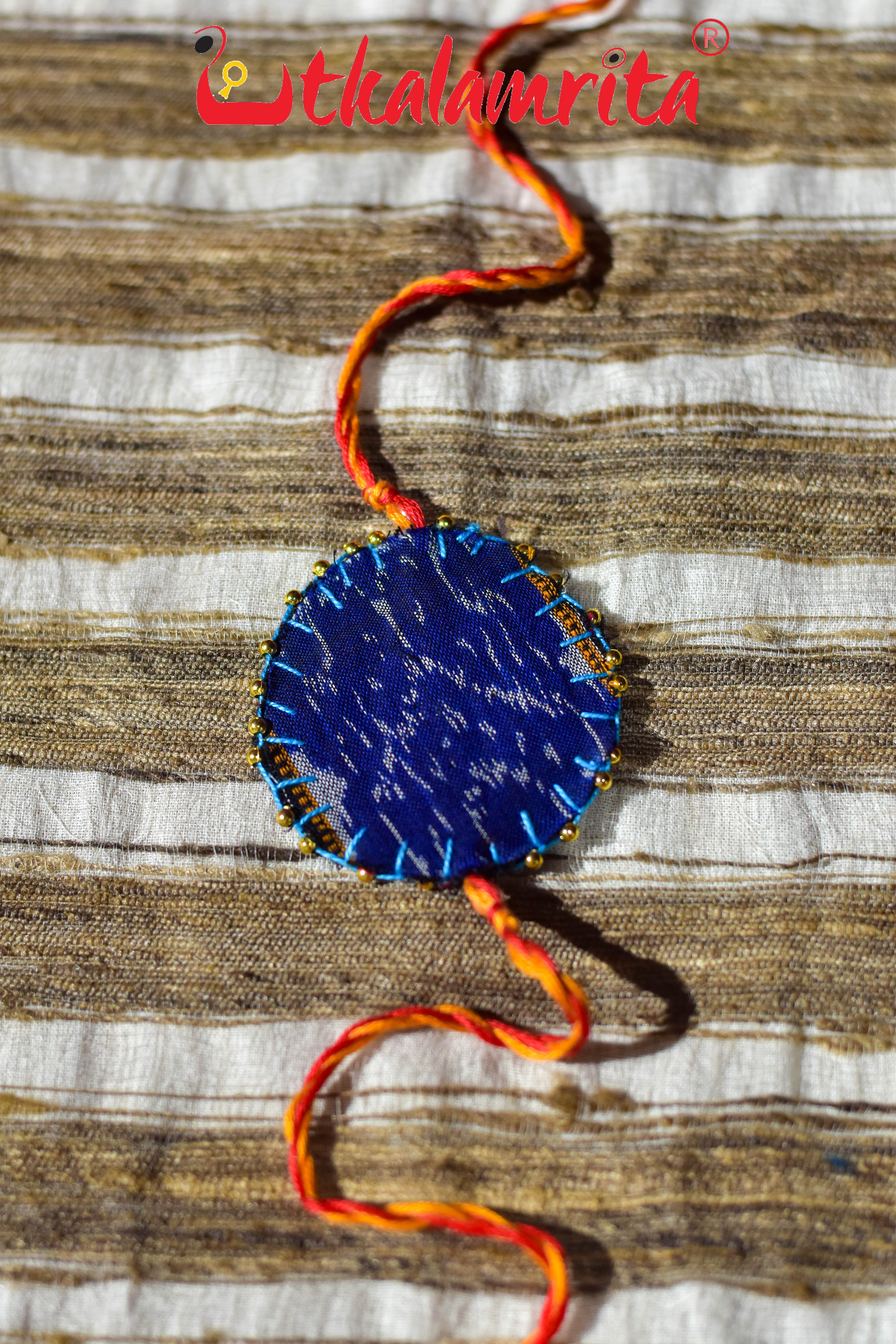 Round S Bandha Red (Ikat Rakhi)