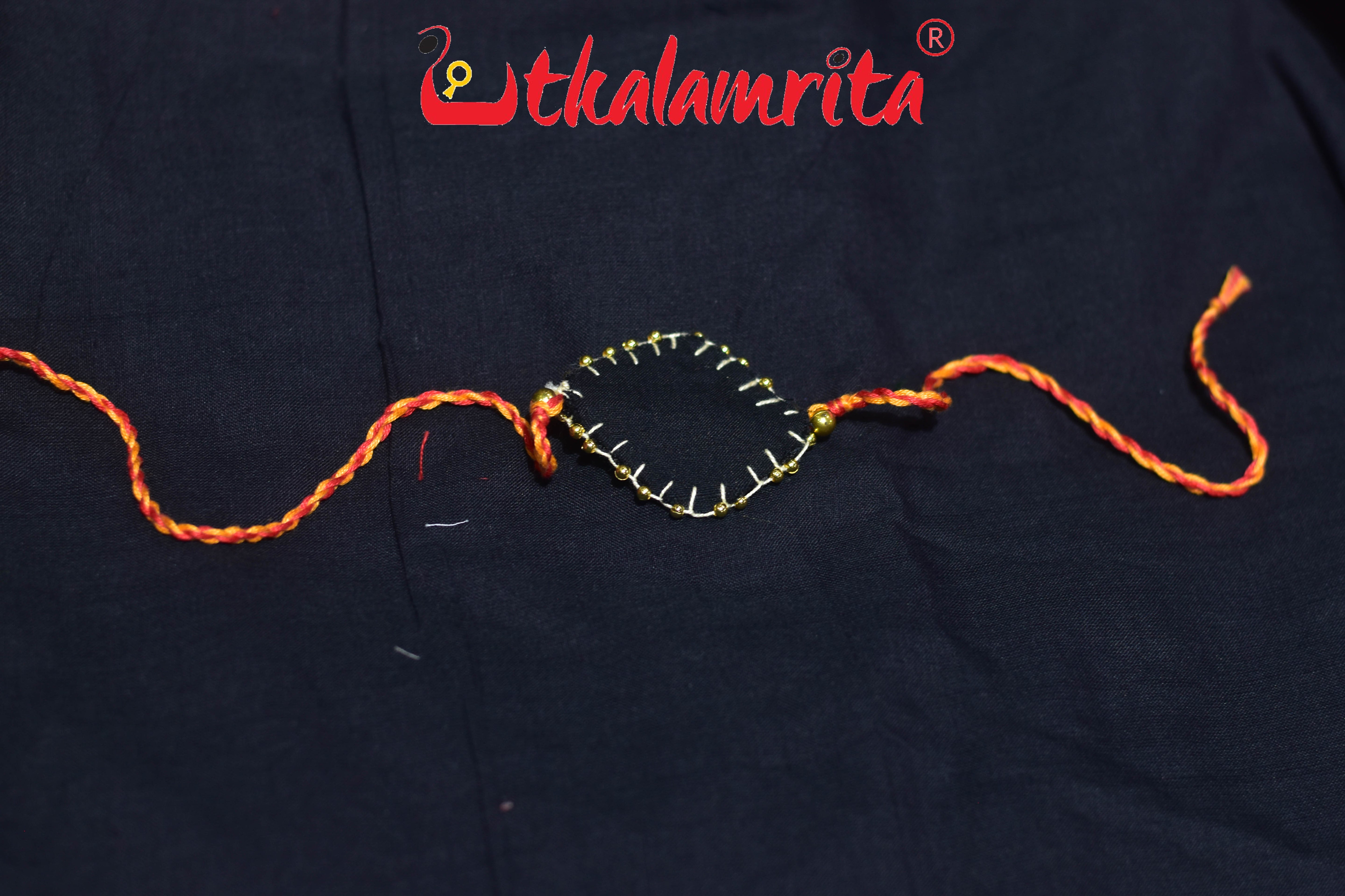 Black Chandrika Golden Mali (Ikat Rakhi)